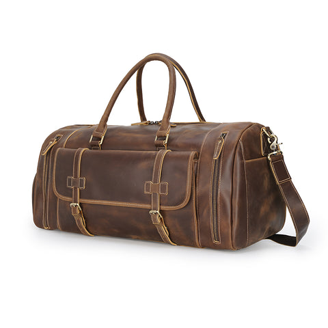 Brown large duffel leather bag with zippered pockets, adjustable shoulder strap and shoe compartment