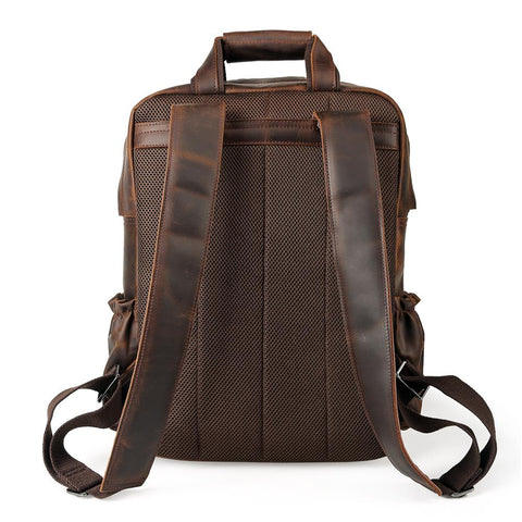 Handmade dark brown full grain cow genuine leather travel backpack bag with laptop compartment, many front pockets and adjustable shoulder strap.