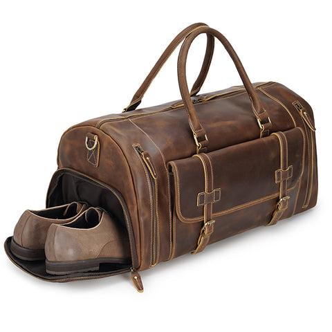 Brown large duffel leather bag with zippered pockets, adjustable shoulder strap and shoe compartment