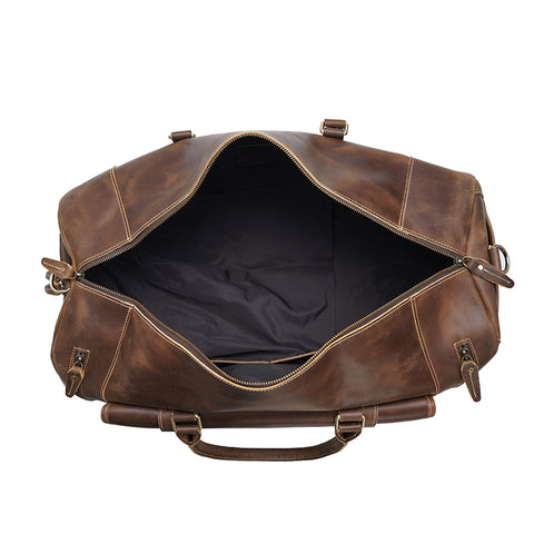 Brown large duffel leather bag with zippered pockets, adjustable shoulder strap and shoe compartment