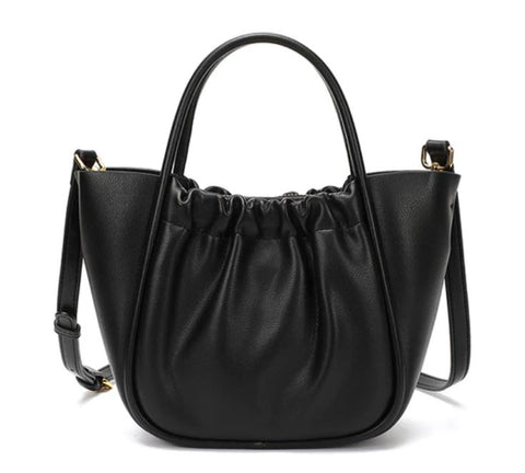 Handmade waterproof black 100% top-grain genuine leather bag for women with inner pockets and inner lining.