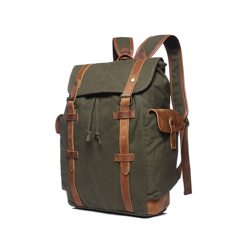 Green water-resistant canvas and leather backpack with pockets and a laptop compartment