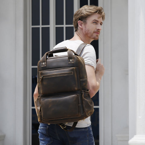 Brown genuine full-grain cowhide leather backpack with pockets and laptop compartment