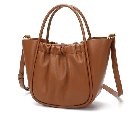 Handmade waterproof ginger 100% top-grain genuine leather bag for women with inner pockets and inner lining.