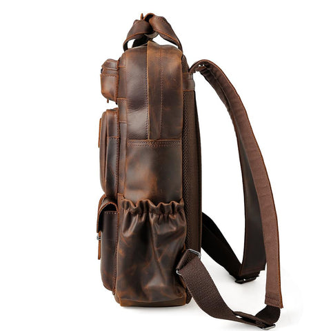 Handmade dark brown full grain cow genuine leather travel backpack bag with laptop compartment, many front pockets and adjustable shoulder strap.