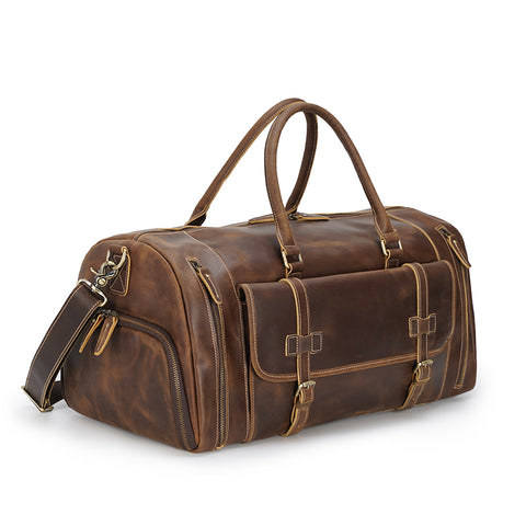 Brown large duffel leather bag with zippered pockets, adjustable shoulder strap and shoe compartment