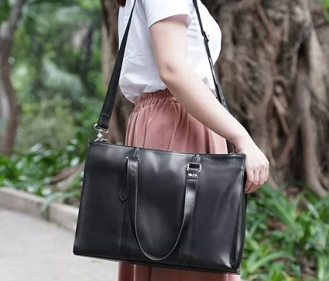 Handmade waterproof black top-grain genuine leather tote bag with laptop compartment, card slots and inner pockets.