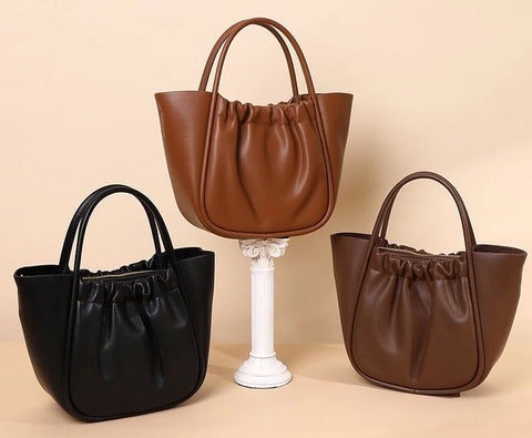 Handmade waterproof 100% top-grain genuine leather bag for women with inner pockets and inner lining.
