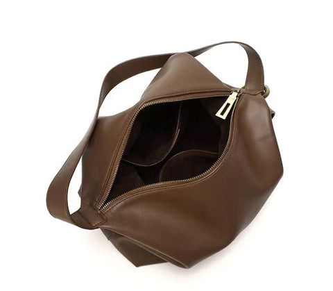 Soft brown waterproof top-grain leather bag with sturdy top, inner pockets and inner lining.