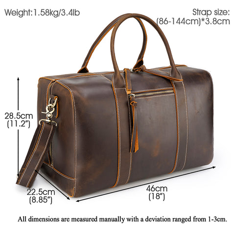 Dark brown duffel leather and canvas bag with large compartments, zippered pockets, and adjustable shoulder strap with buckle detail