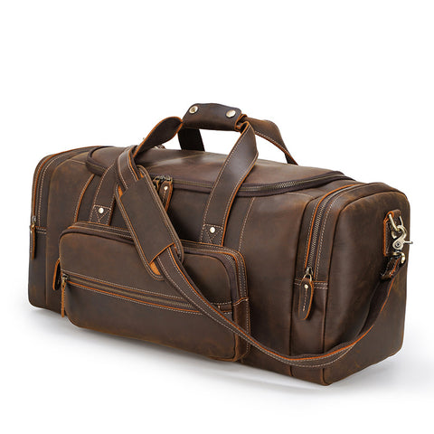 Brown genuine Leather travel bag with laptop compartment, sturdy top handles and adjustable shoulder strap with buckle detail
